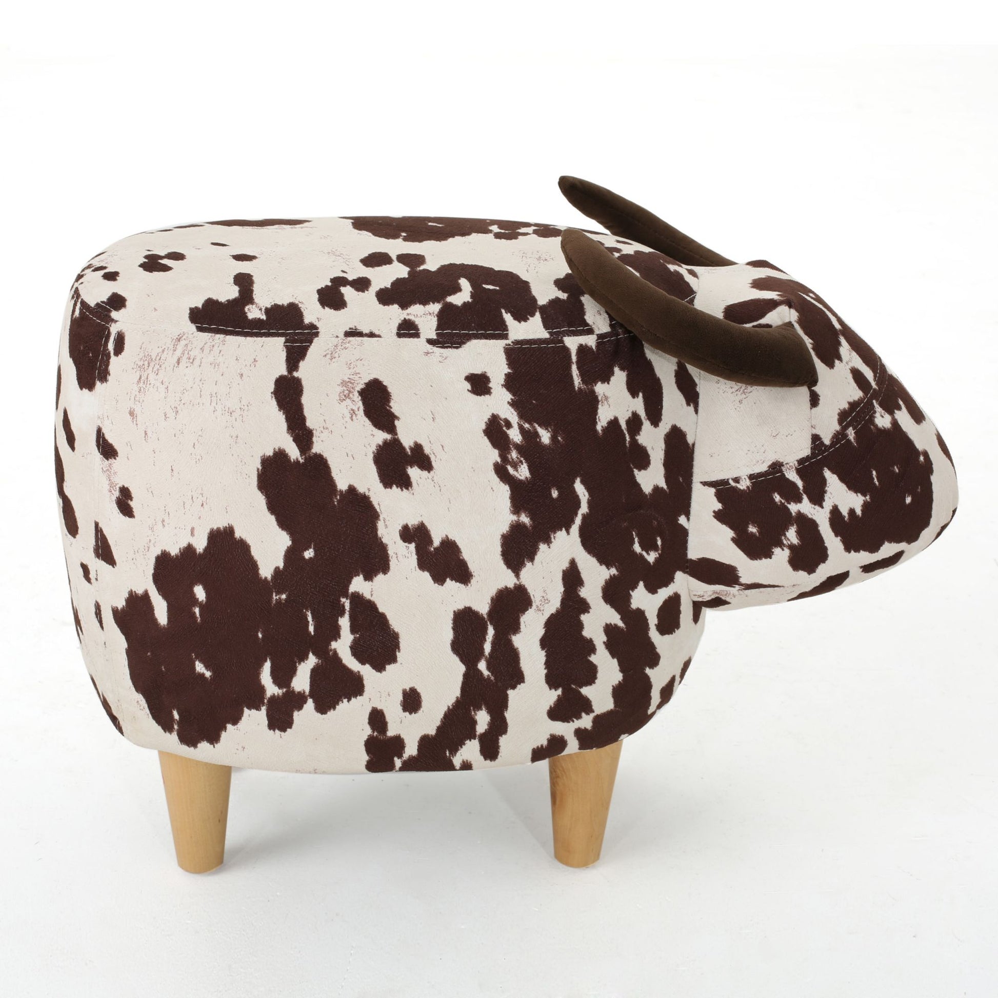 Farm animal ottoman with cow print fabric and brown horns