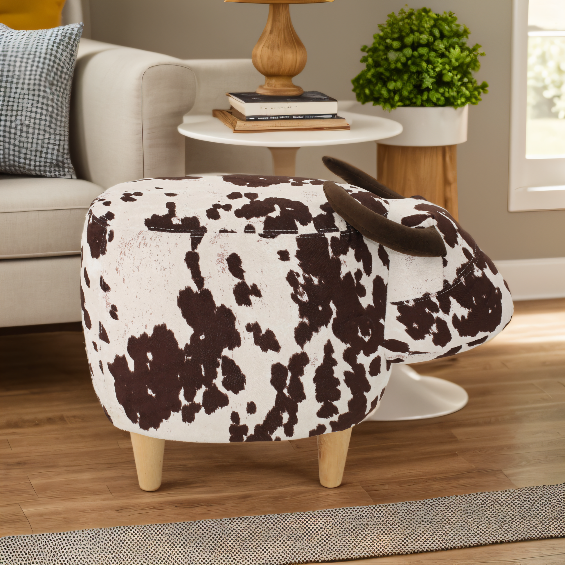 Brown and white cow print ottoman with horns