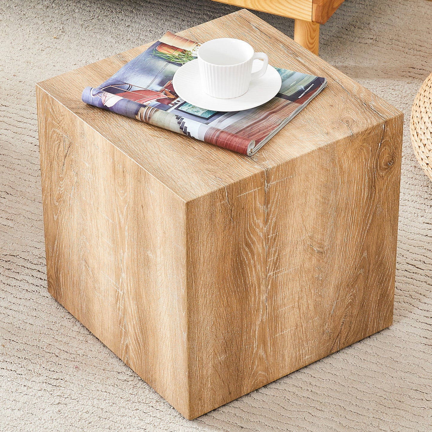 Natural wood grain cube end table with magazine and coffee cup