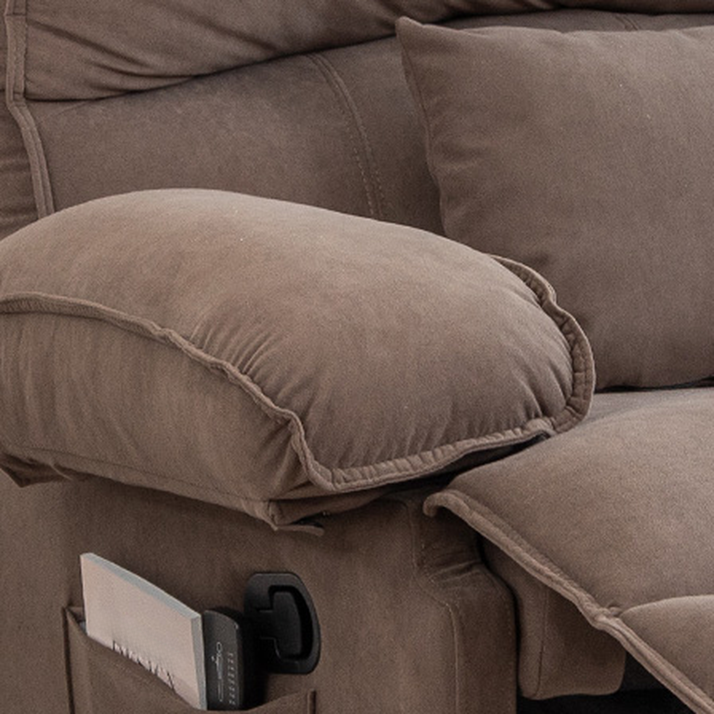 Plush brown reclining sofa armrest with builtin side pocket for magazines