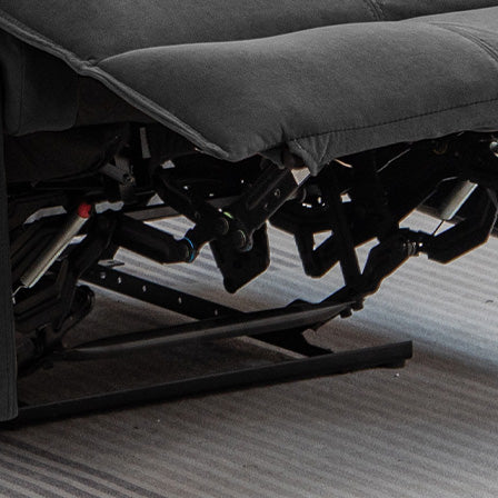 Closeup of black metal recliner mechanism with pneumatic lift