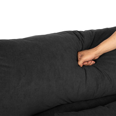 Dark grey plush sofa cushion showing deep comfort
