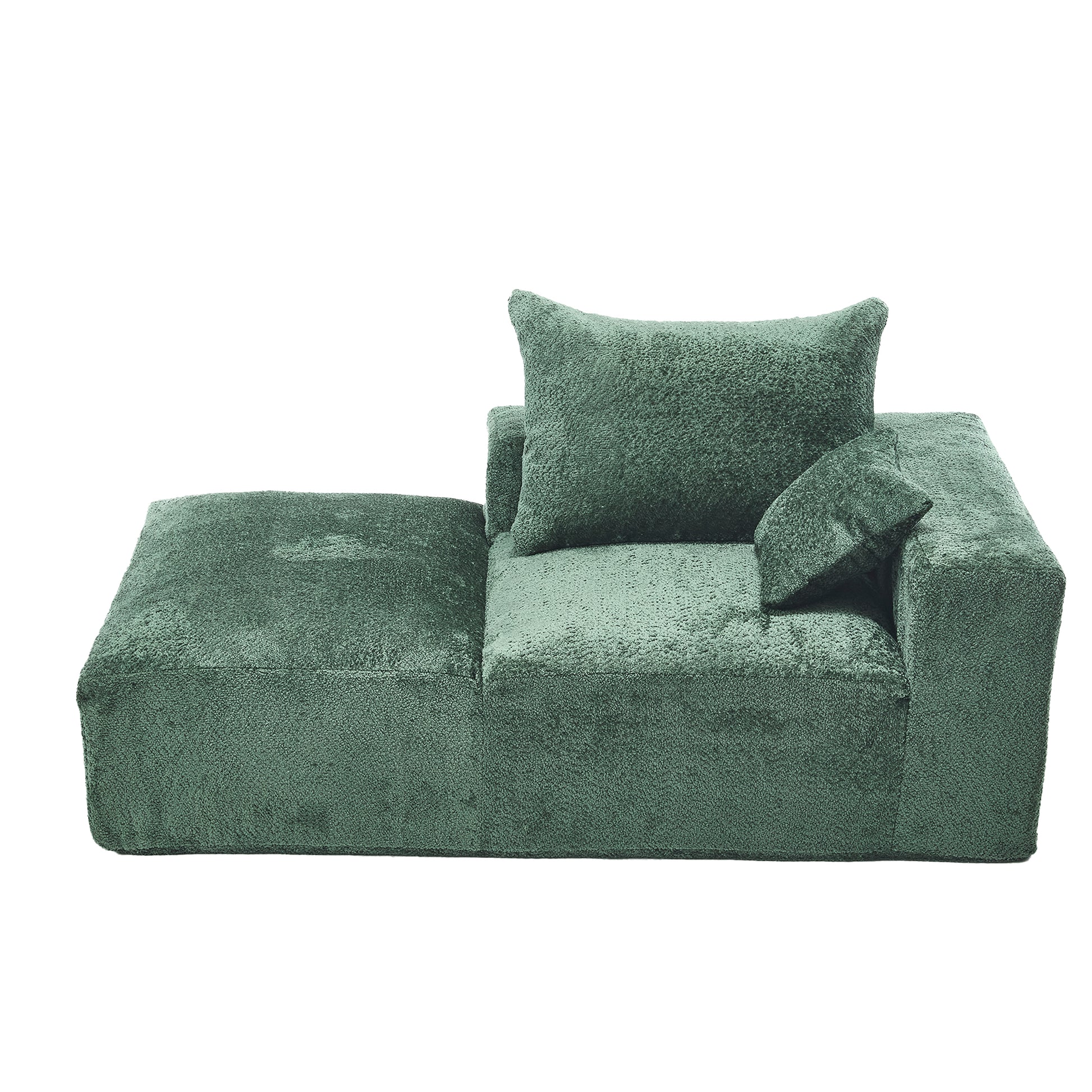 Plush green sectional sofa with ottoman and accent pillows