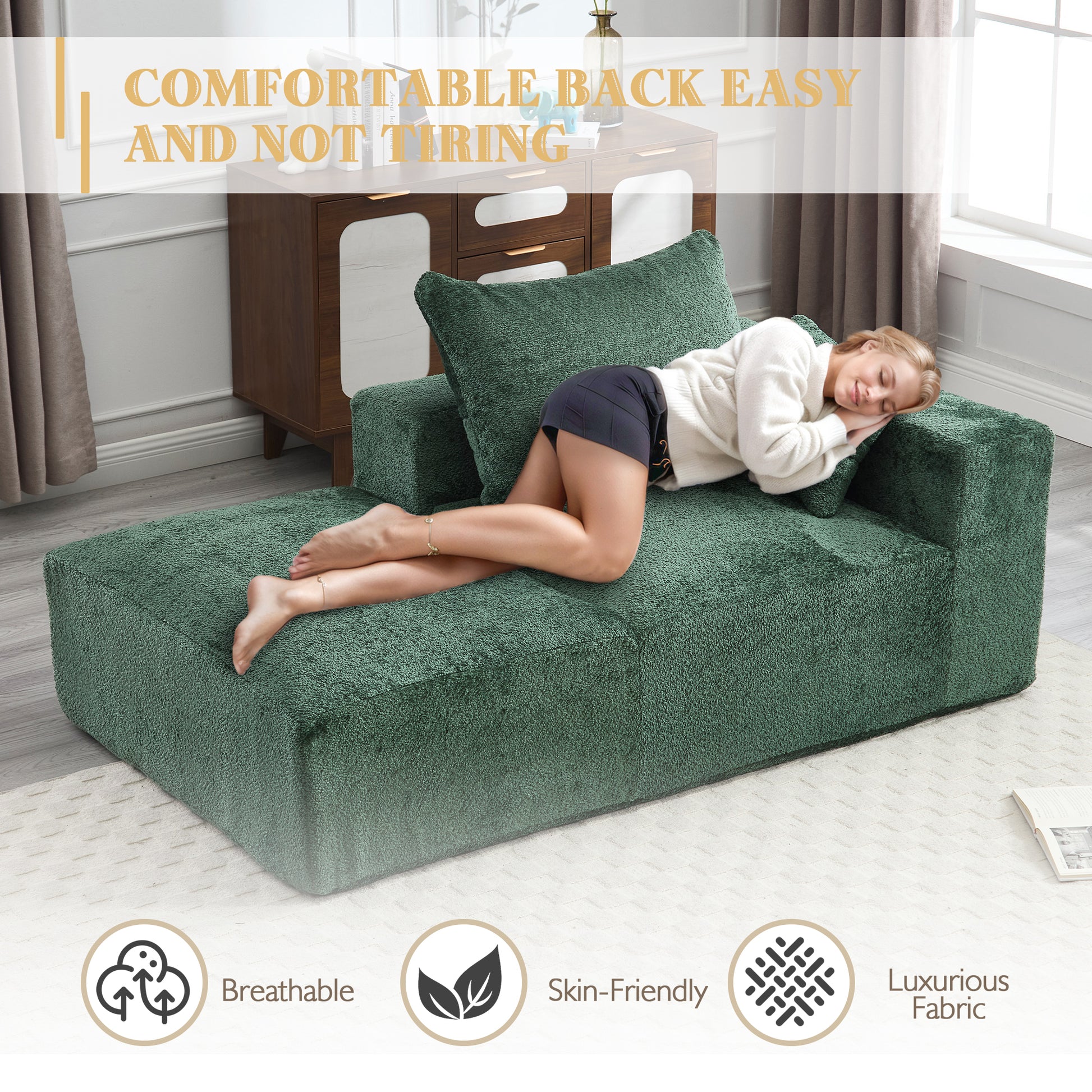 Plush green sectional chaise lounge with a woman relaxing
