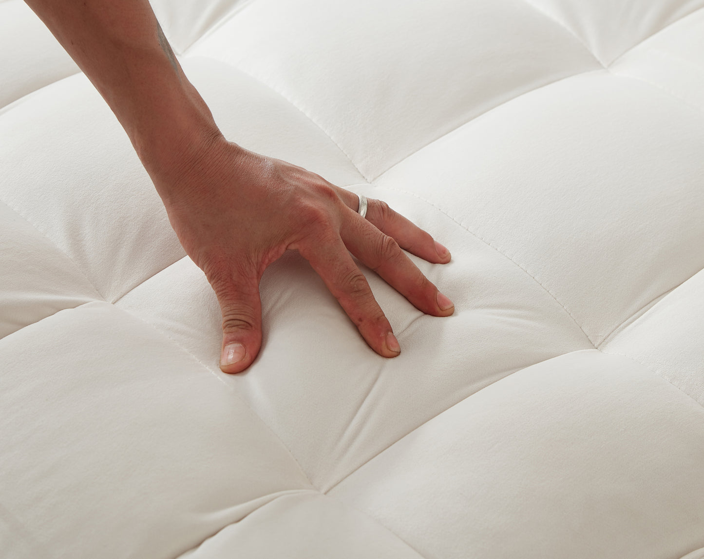White plush sofa cushion with diamond stitching
