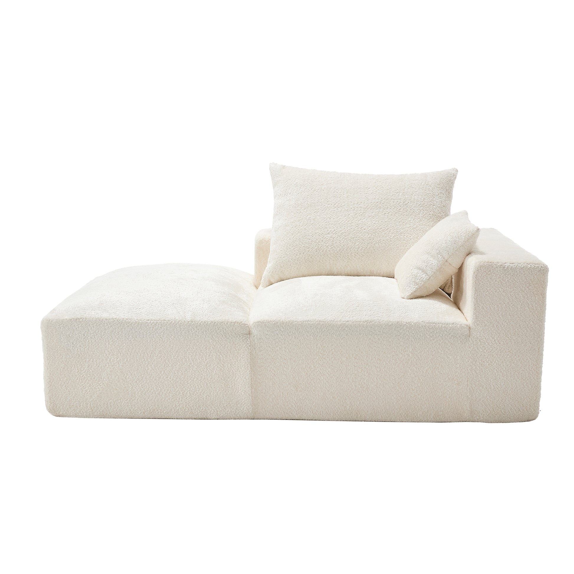 Cream boucle chaise lounge with two plush throw pillows