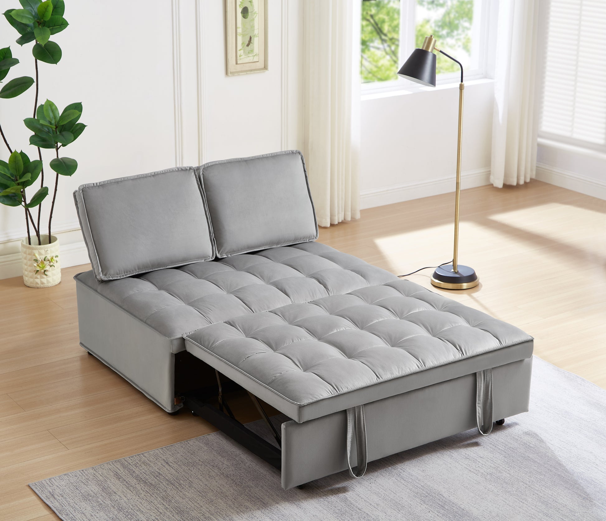 Gray velvet tufted sofa bed with pullout mattress mechanism