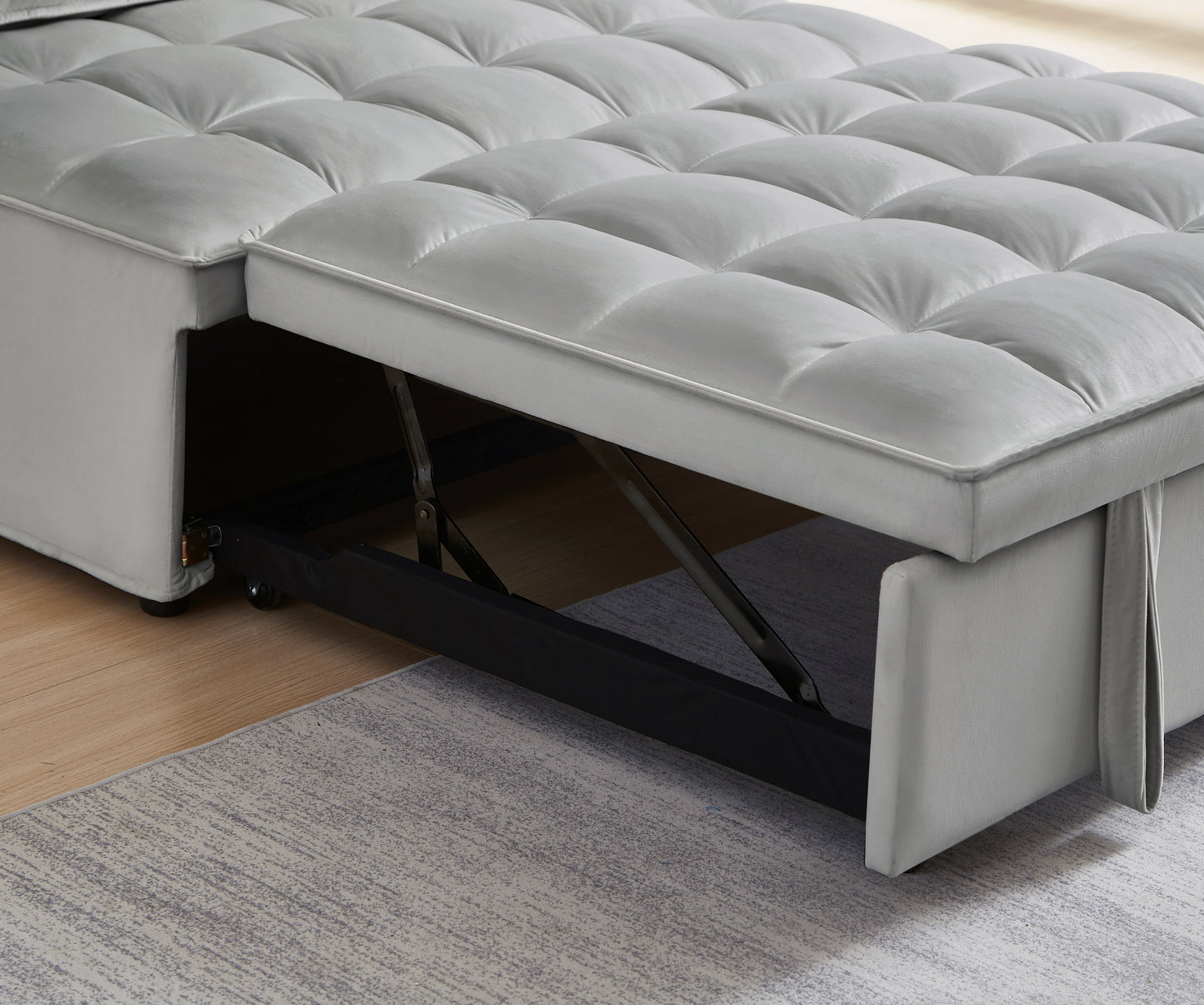 Grey velvet tufted sofa bed with pullout storage mechanism