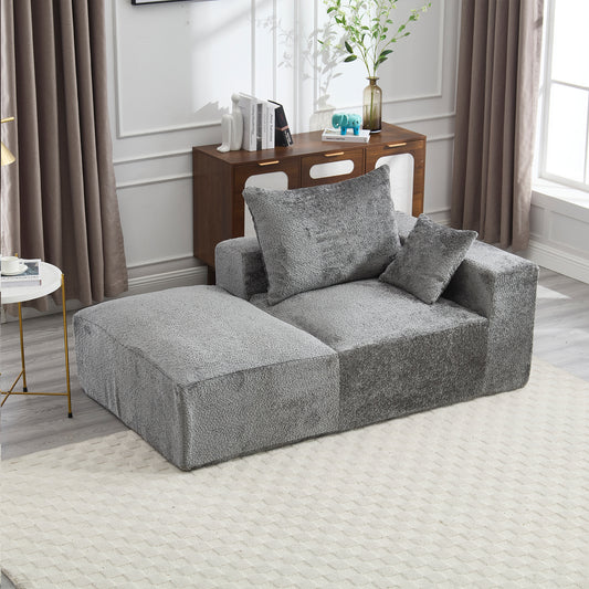 Plush grey sectional sofa with modular design and textured fabric
