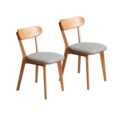 Two light wood dining chairs with grey fabric seats and curved backrests