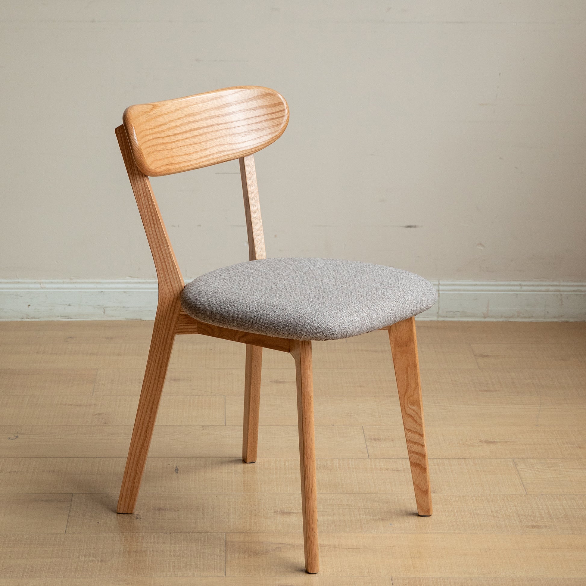 Wooden dining chair with grey fabric seat