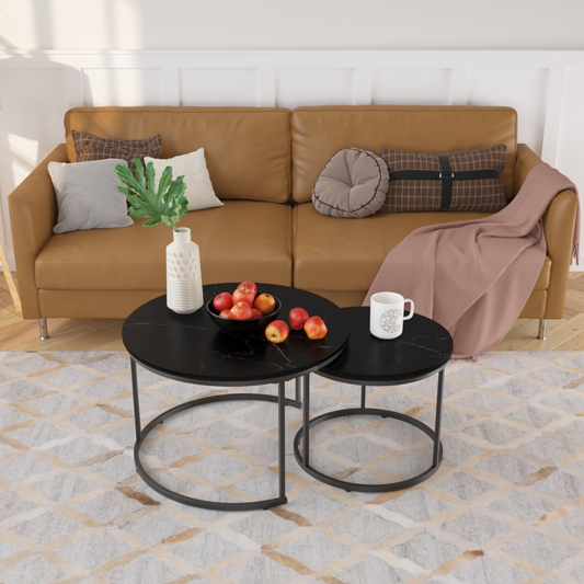 Black marble nesting coffee tables with metal legs and a modern design