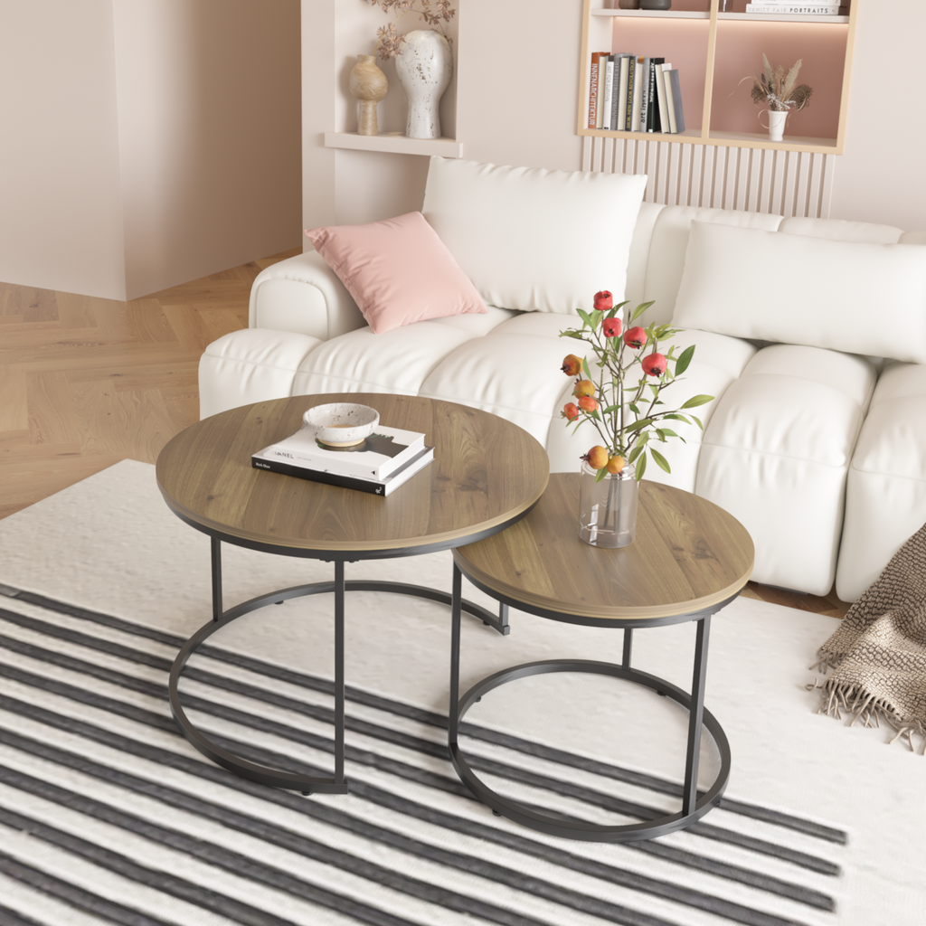 Round walnut nesting coffee tables with black metal legs