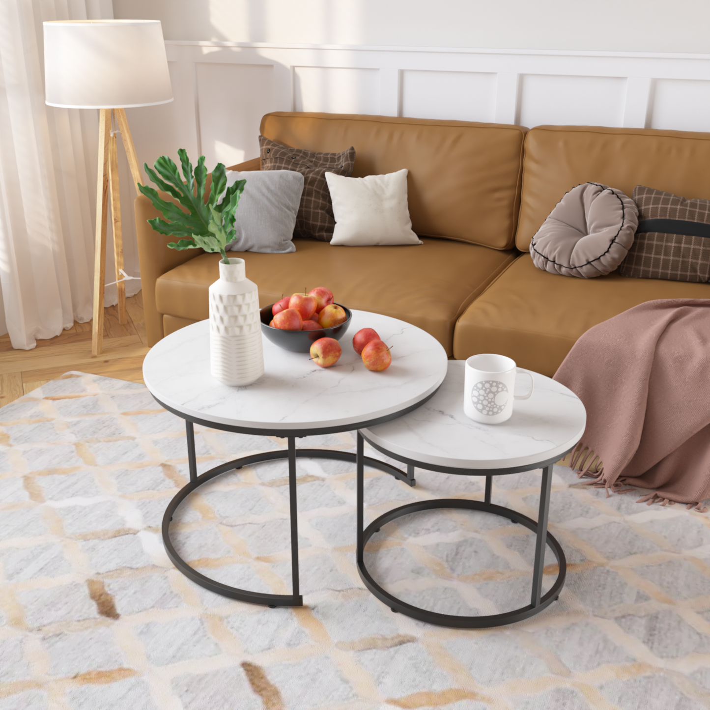 Modern nesting coffee tables with white marble tops and black metal legs