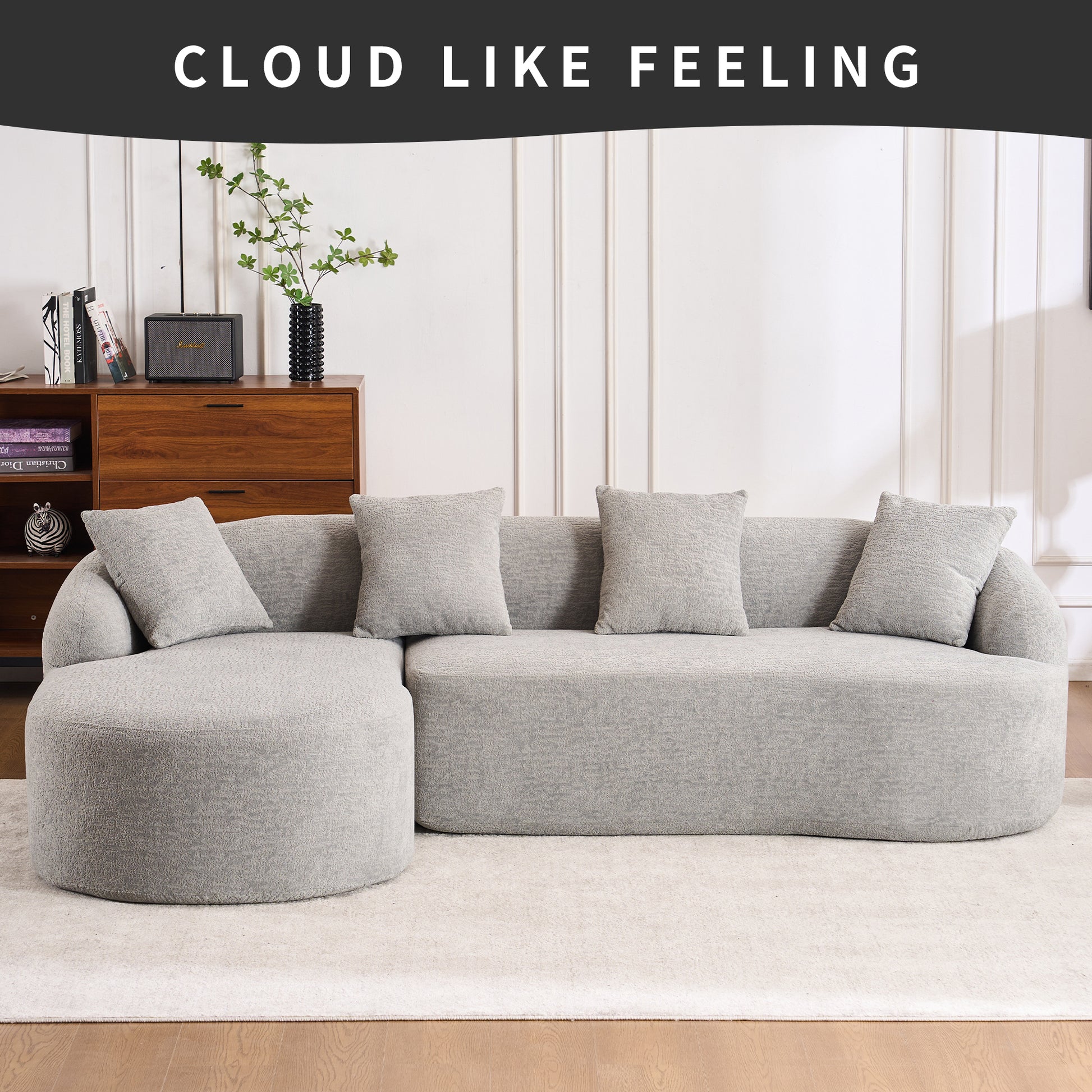 Curved gray sectional sofa with textured fabric and four matching throw pillows