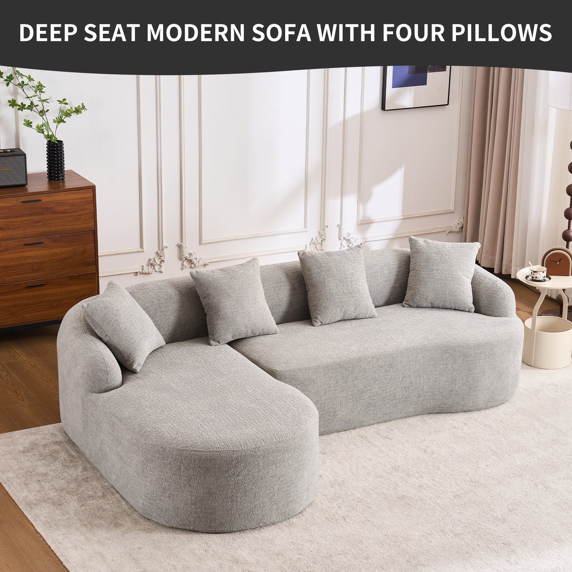 Light gray fabric sectional sofa with plush pillows