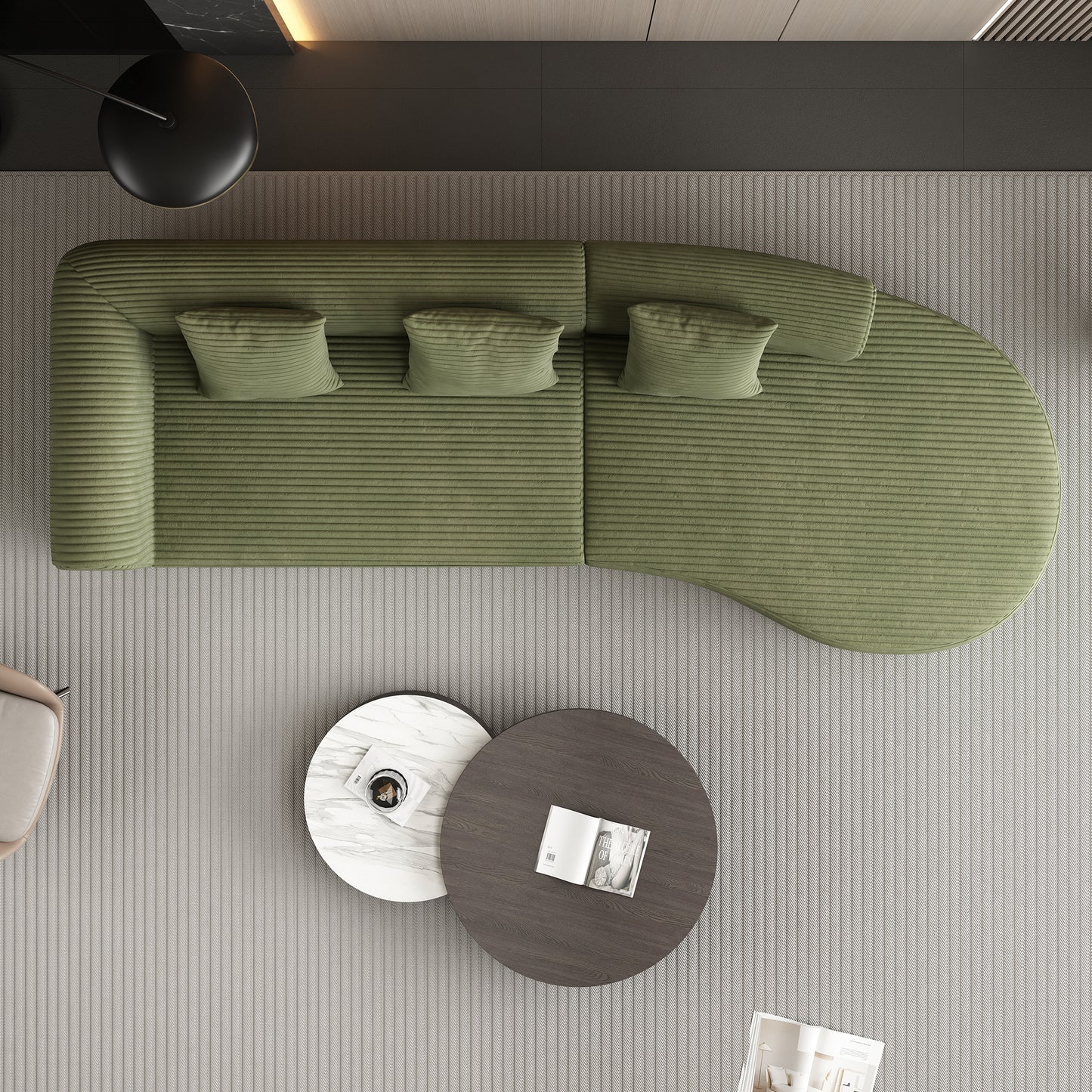 Green corduroy curved sectional sofa with throw pillows on a striped rug