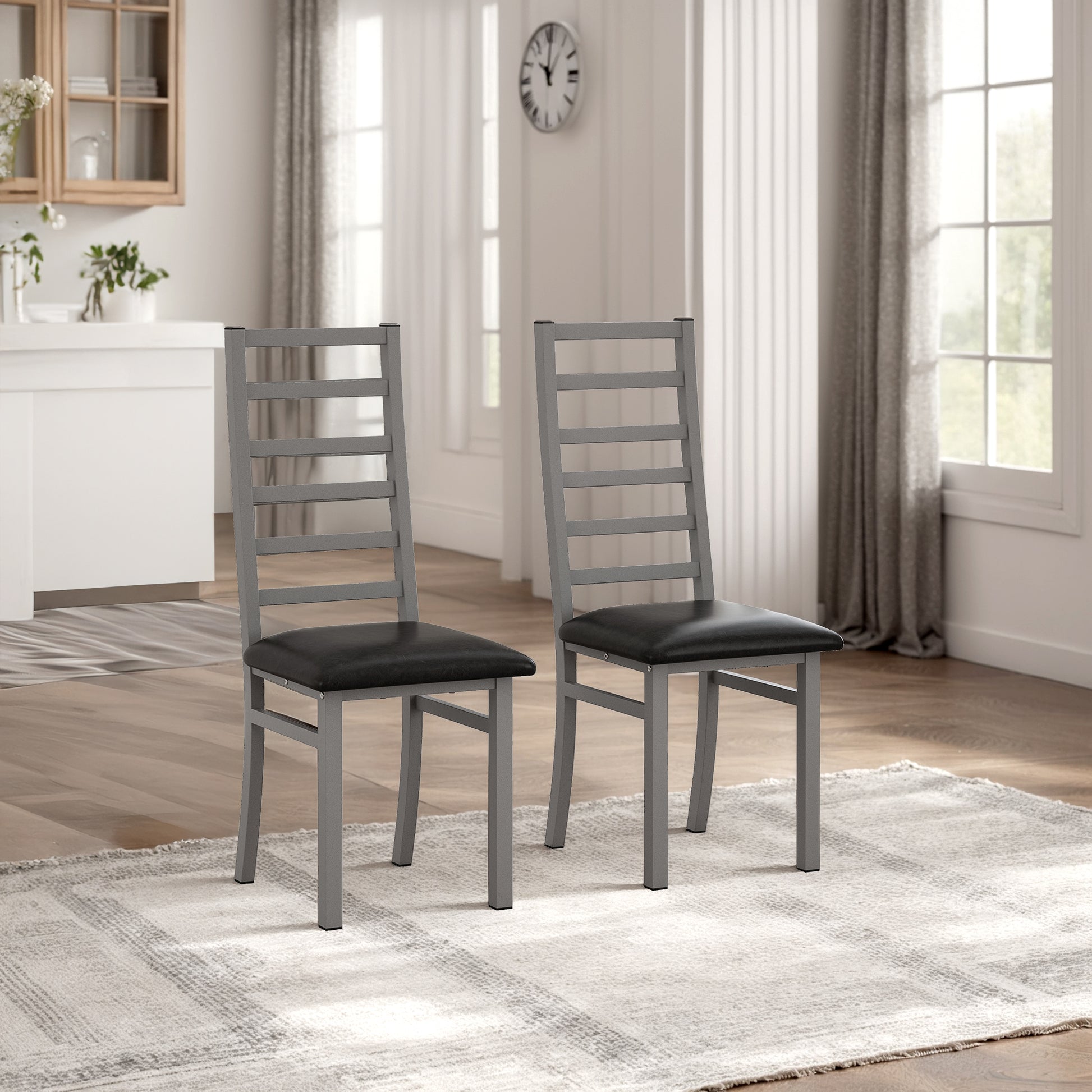 Pair of gray metal dining chairs with black upholstered seats