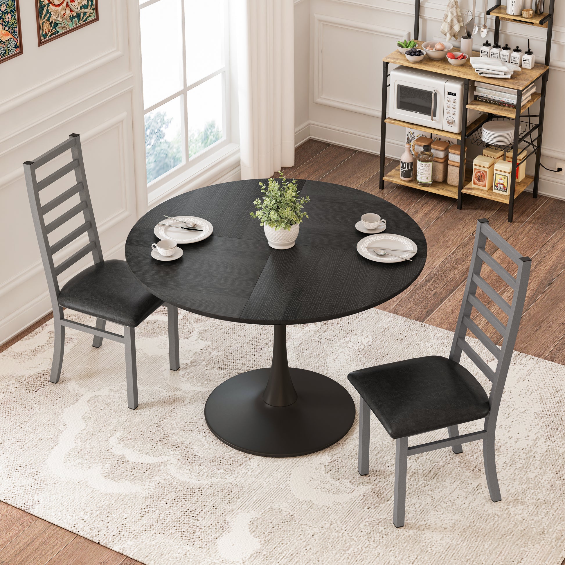 Black round dining table with textured wood grain surface and pedestal base