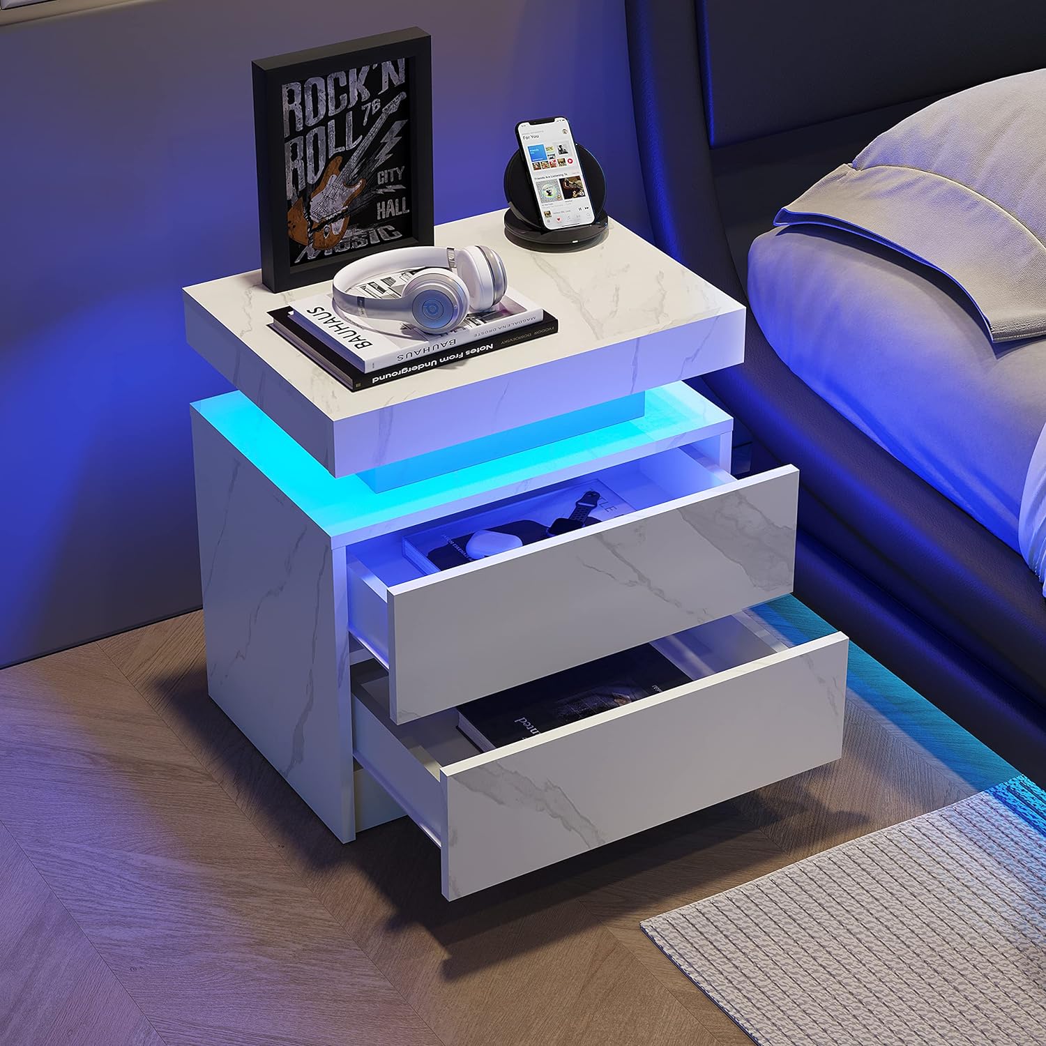 Modern white nightstand with marble finish and blue LED lighting