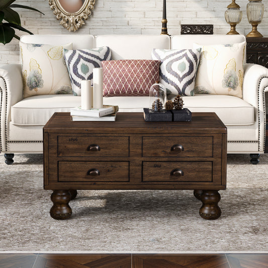 Dark wood coffee table with four drawers and antique bronze pulls on ornate legs