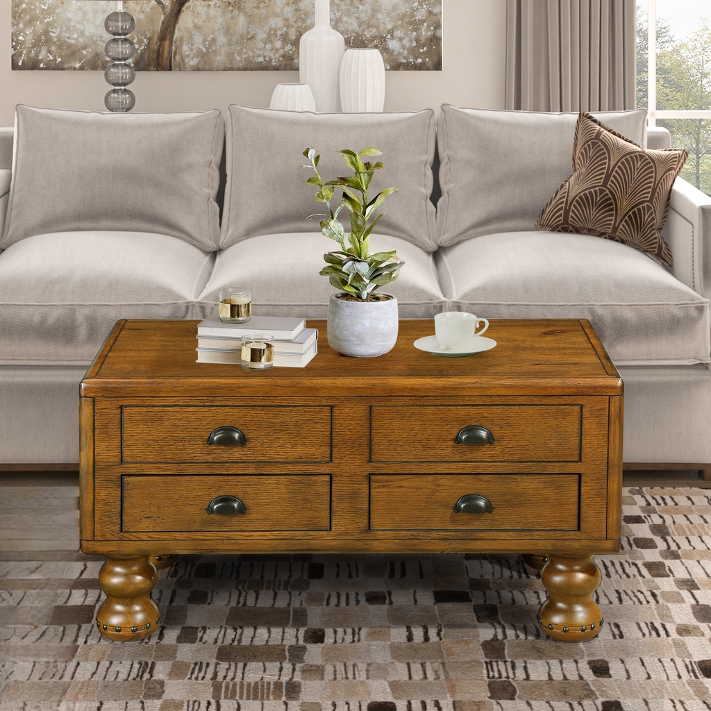 Rustic oak coffee table with four drawers and dark metal pulls
