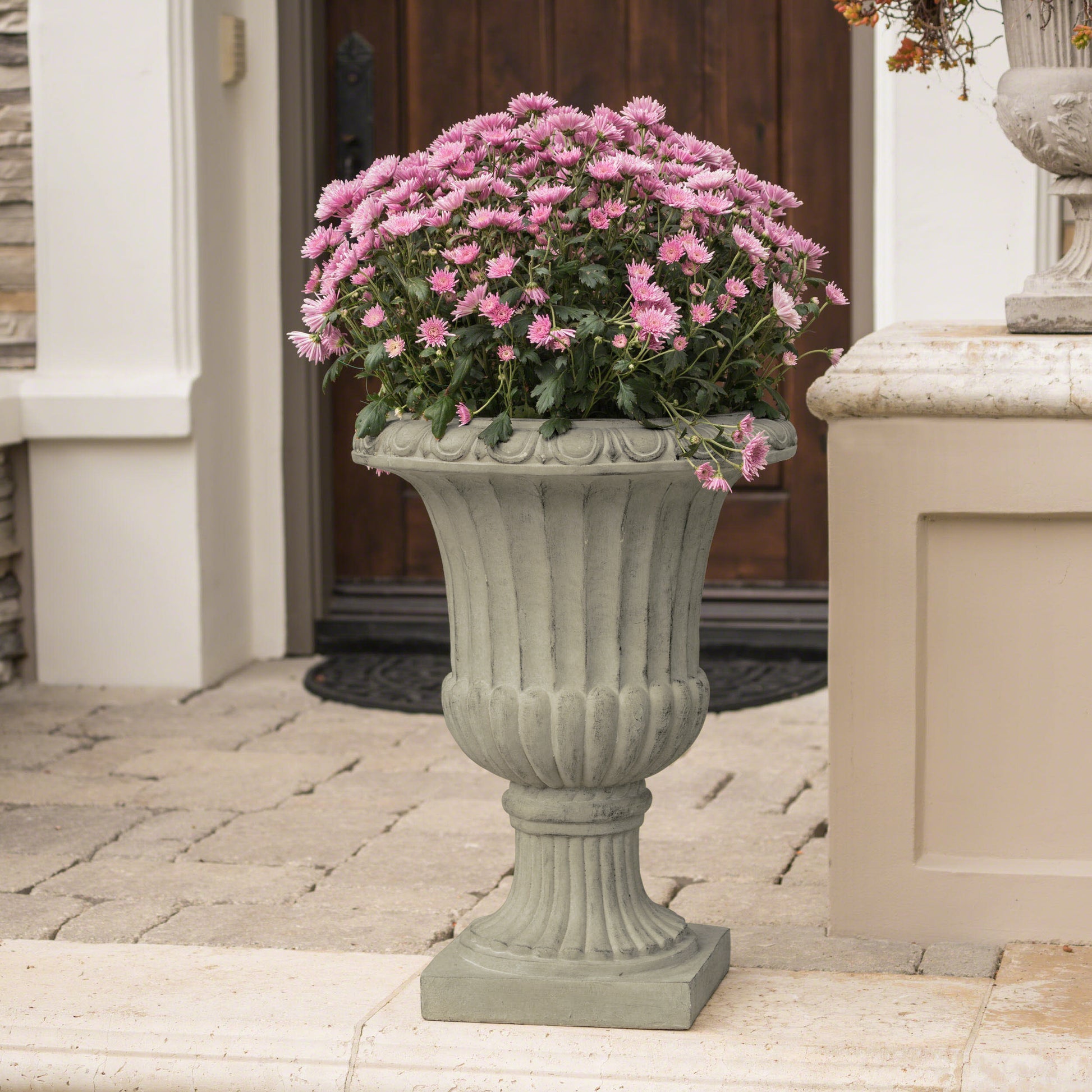 Vintage urn planter with pink mums