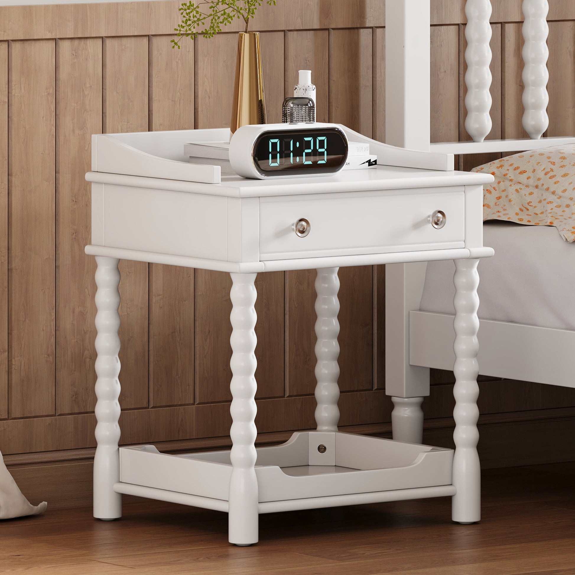 White spindle leg nightstand with a single drawer and silver knob