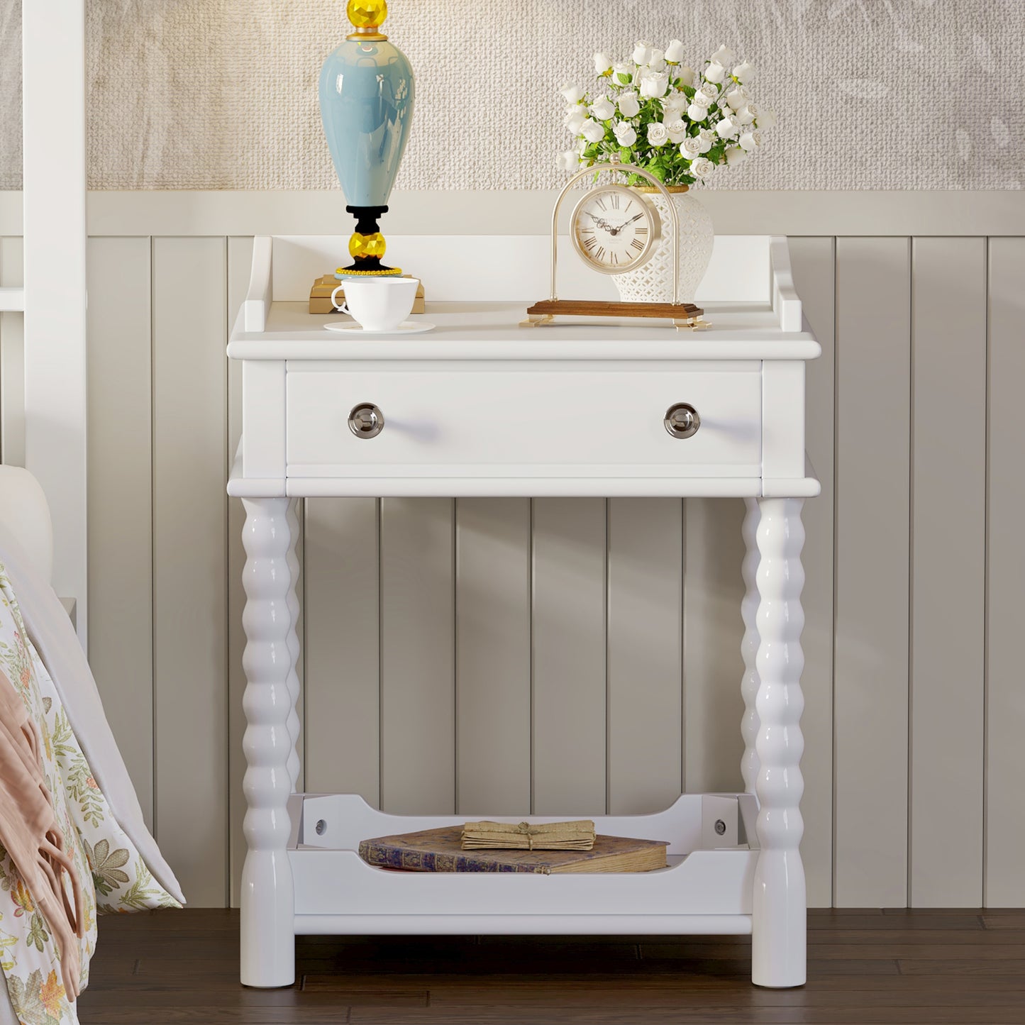 White wooden nightstand with turned legs and a drawer