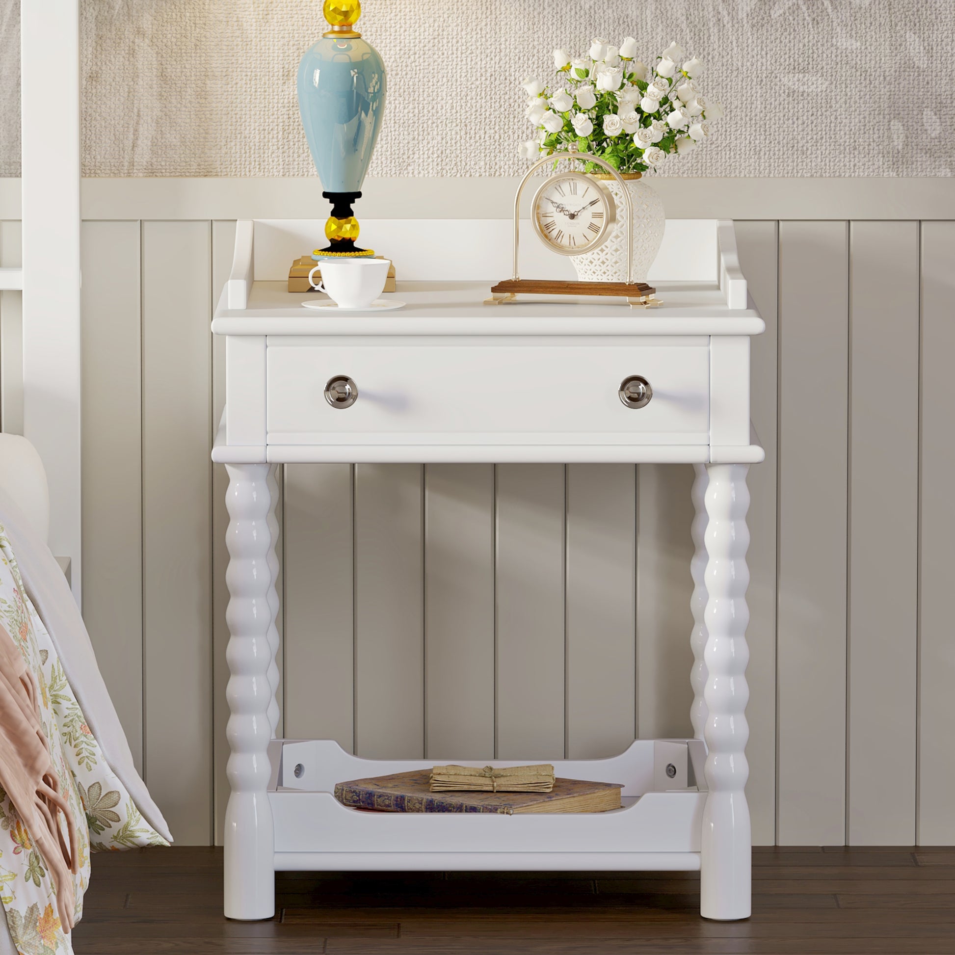 White wooden nightstand with turned legs and a drawer