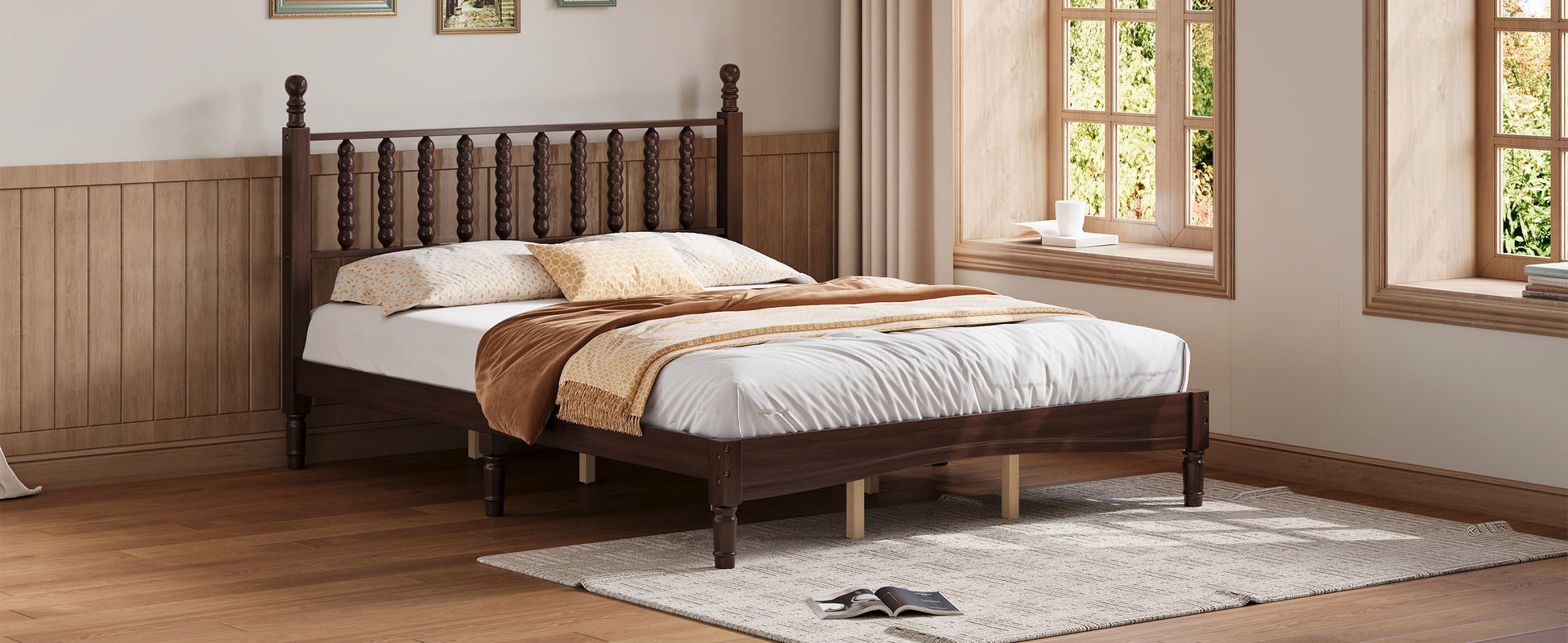 Dark wood spindle bed frame with white mattress and patterned pillows