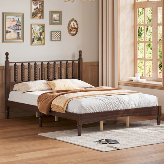 Dark wood spindle headboard bed frame with white linens and patterned pillows