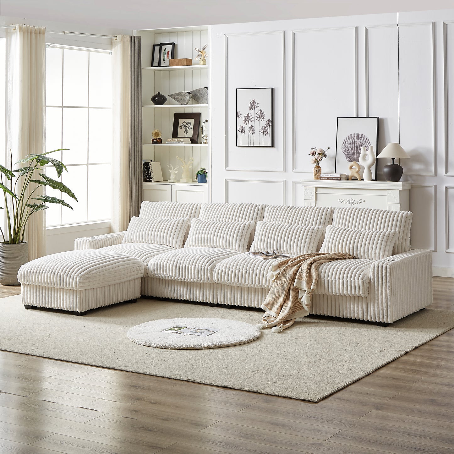 Cream corduroy sectional sofa with plush cushions and a matching ottoman