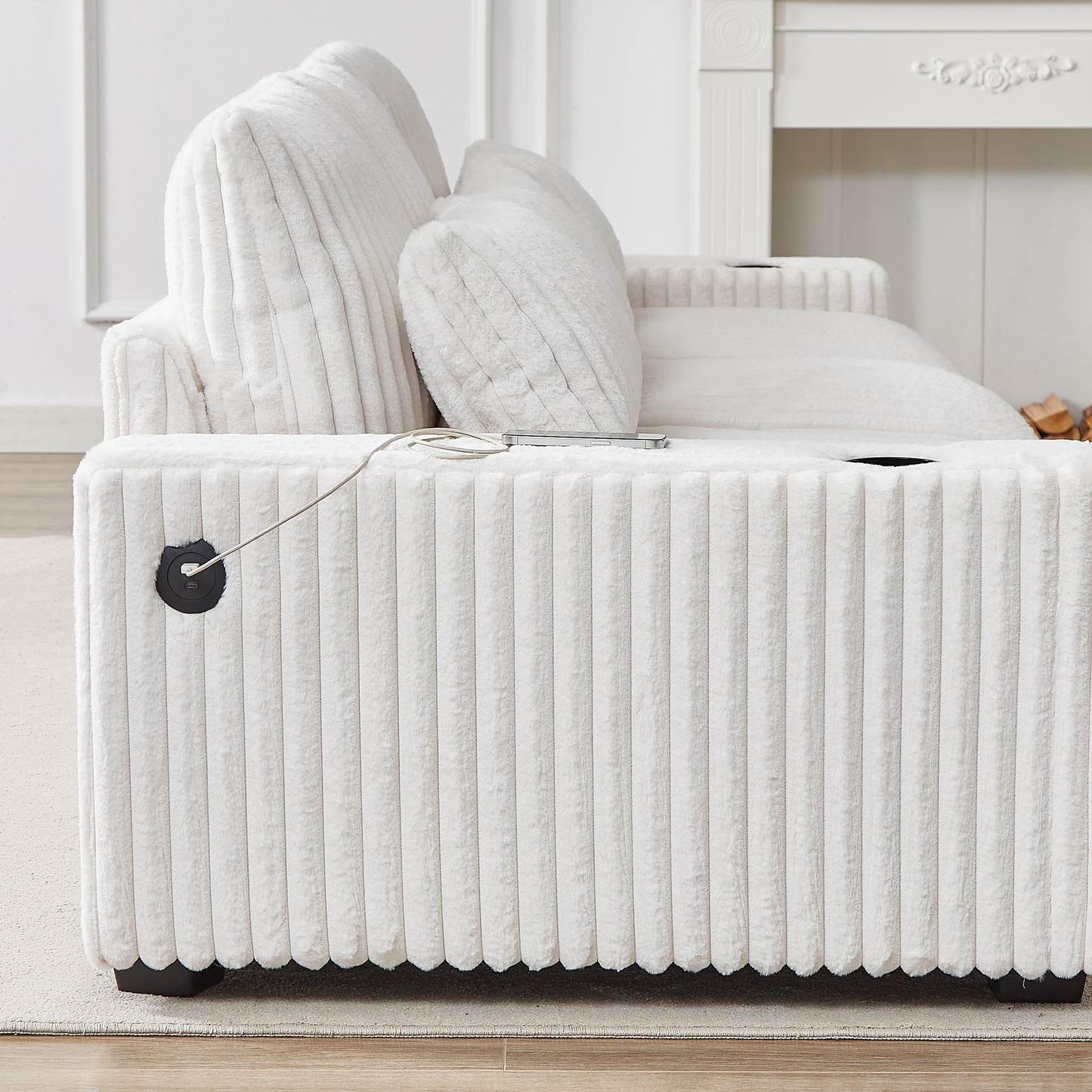 Plush white corduroy sofa with integrated USB charging port on the armrest