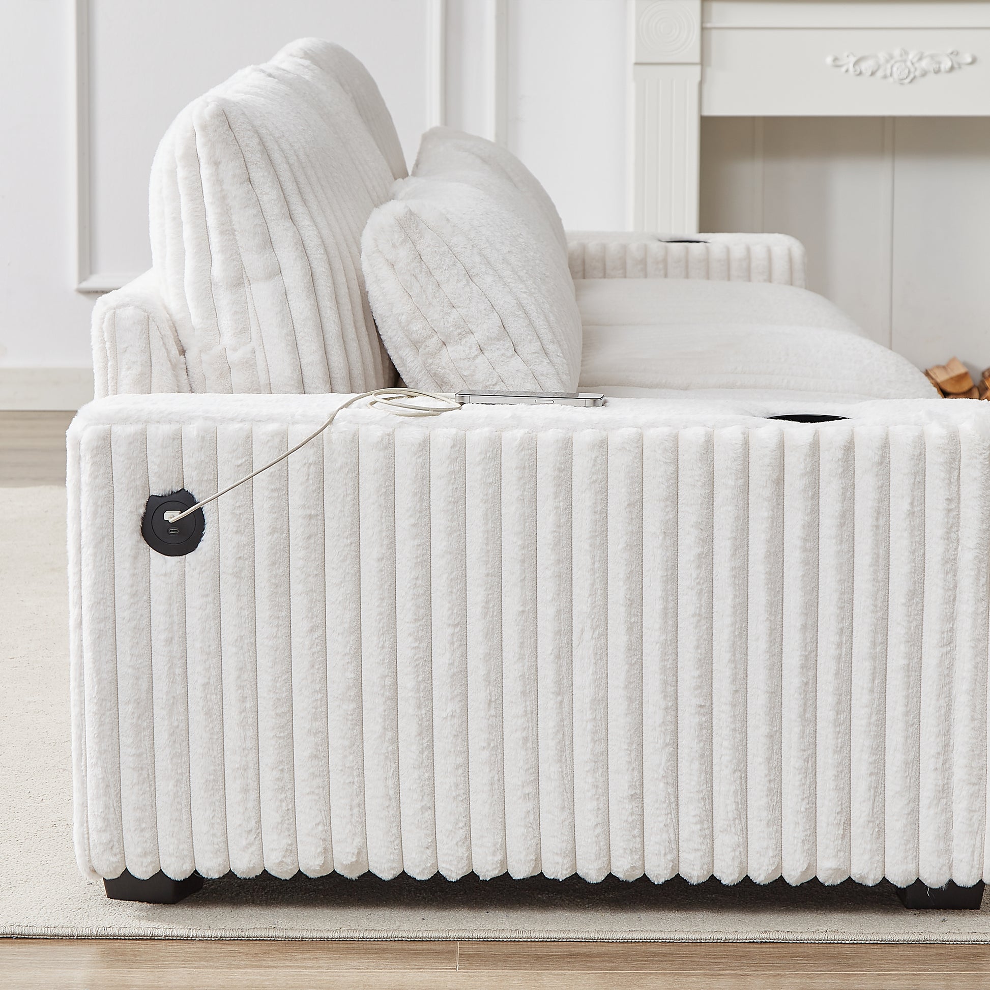Plush white corduroy sofa with integrated USB charging port on the armrest