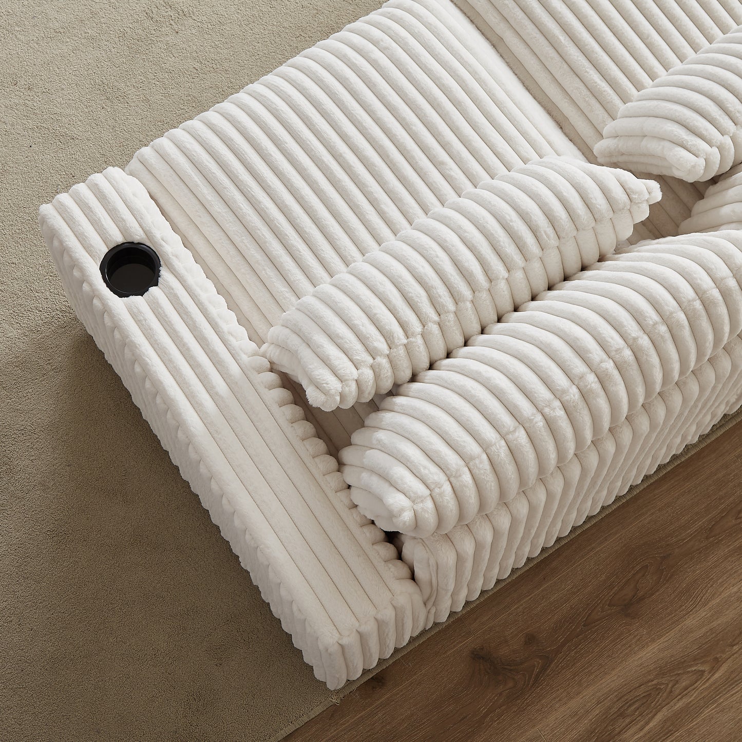 Plush white corduroy reclining sofa with builtin cup holder