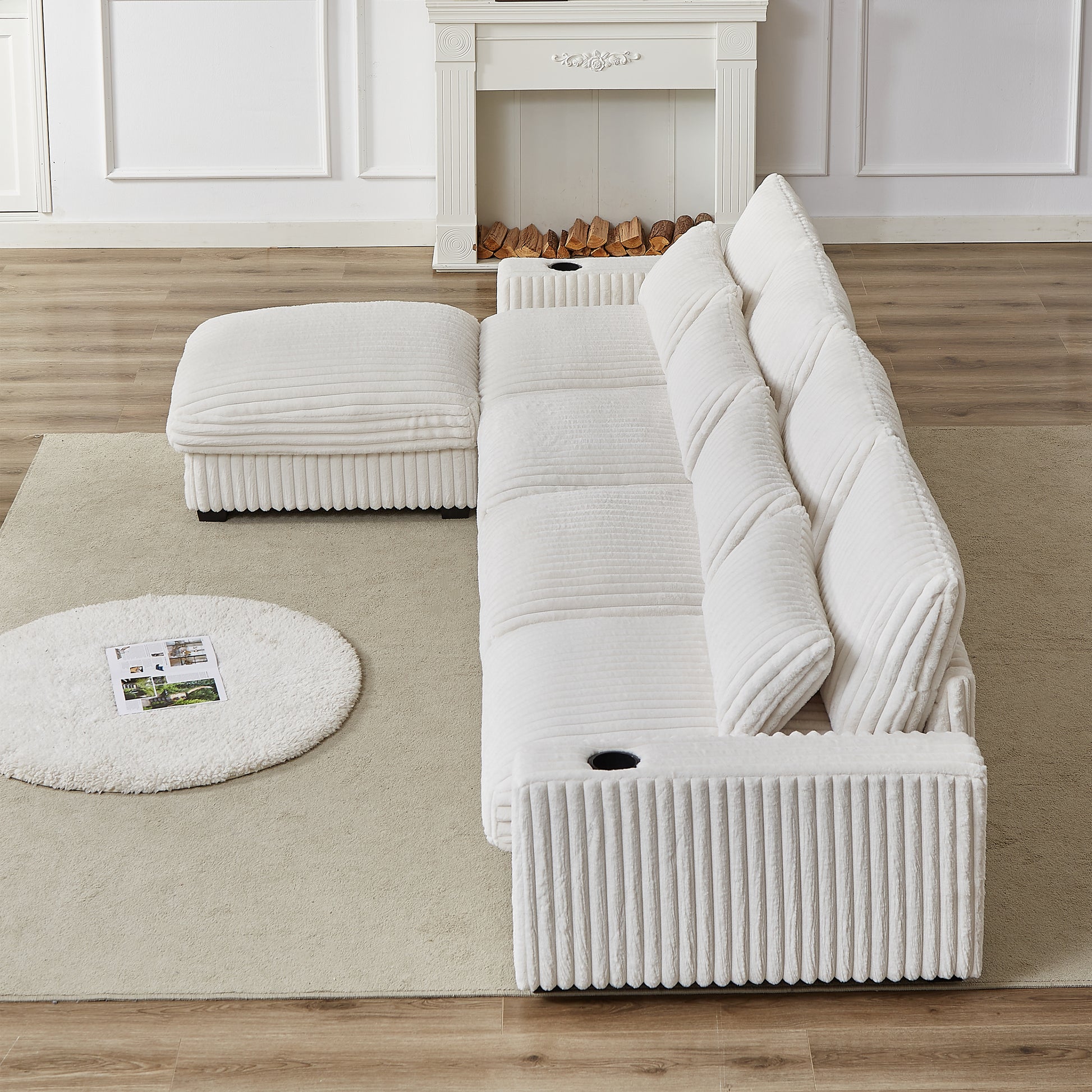 Plush white sectional sofa with integrated cup holders and ottoman