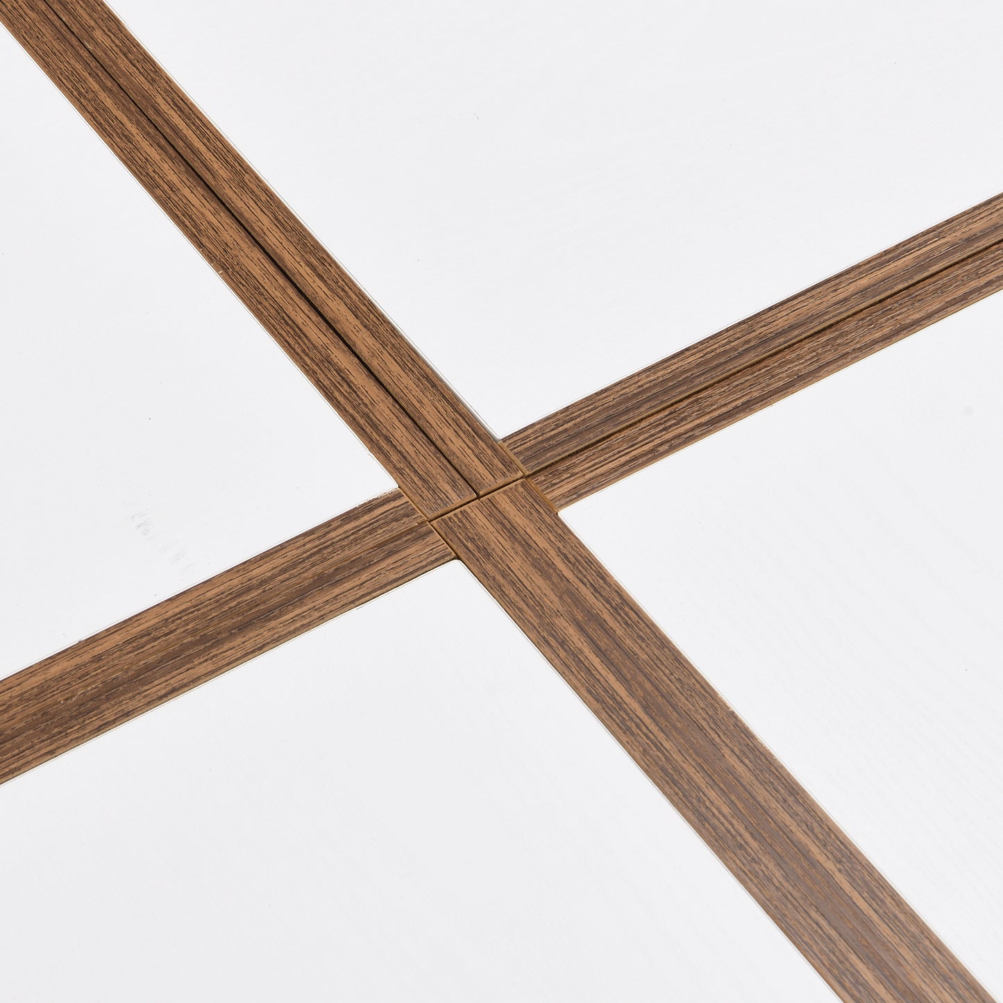 White surface with crossing dark wood veneer trim