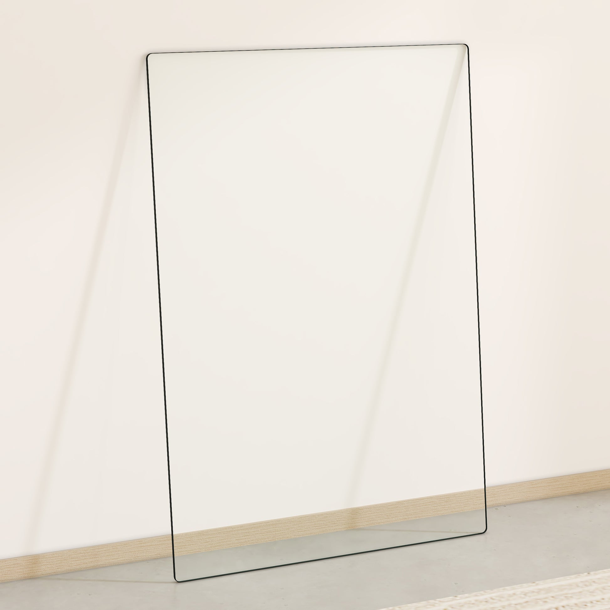 Tall frameless leaning mirror with thin black trim