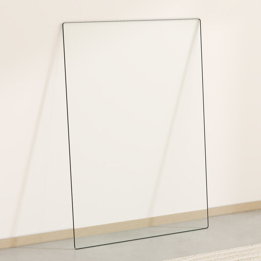 Tall frameless leaning mirror with thin black trim