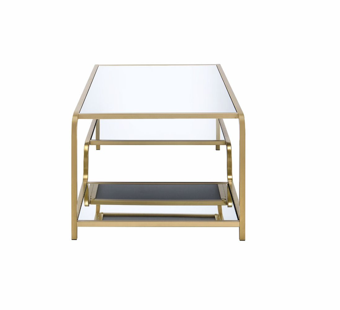 Gold metal coffee table with mirrored top and shelves