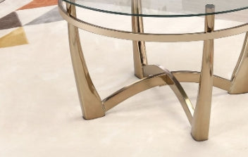 Modern gold coffee table with glass top and curved legs