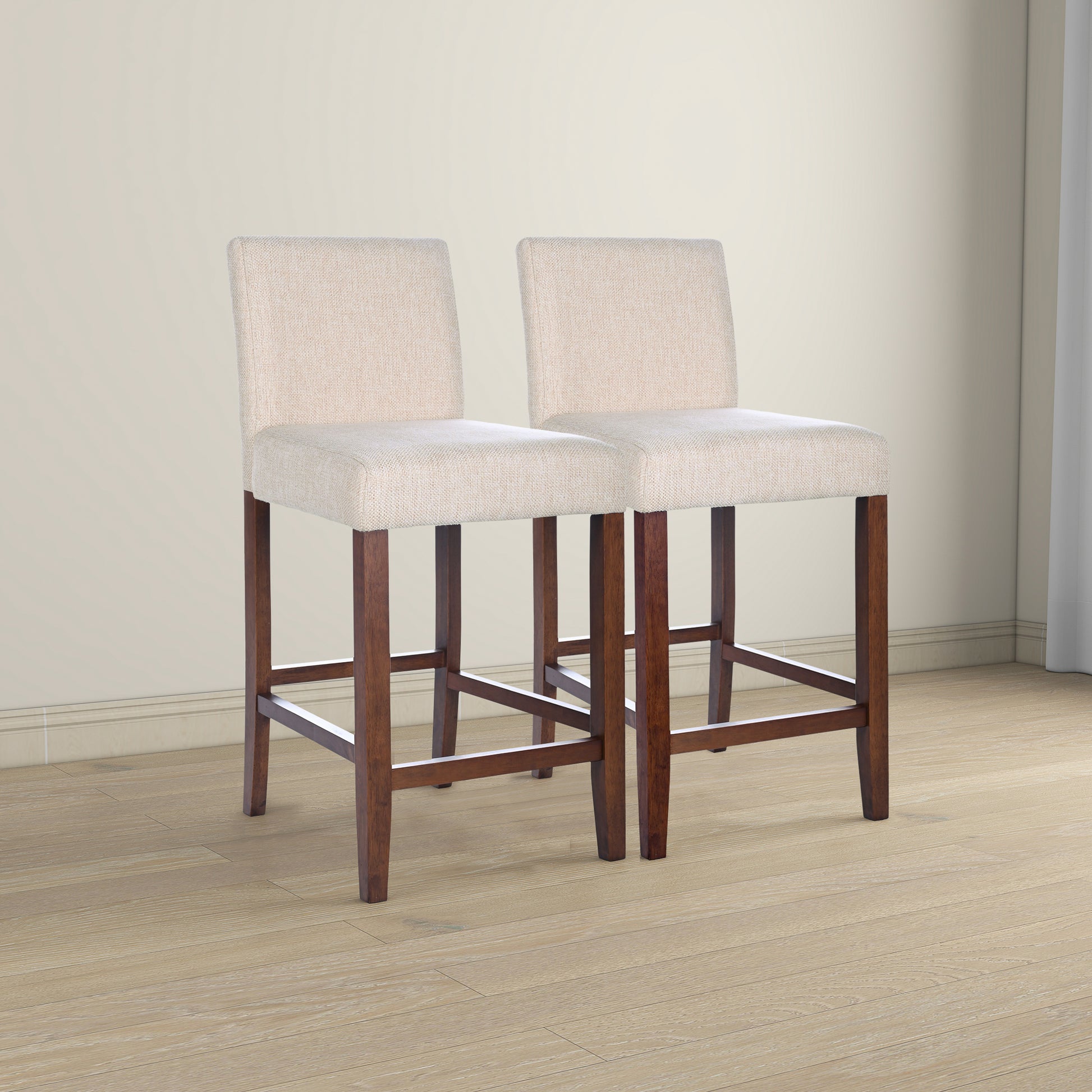 Two beige upholstered bar stools with dark wood legs