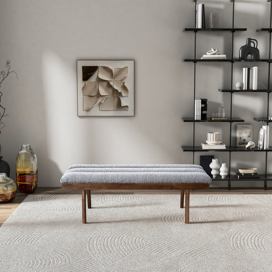 Modern grey textured bench with wooden legs and a boucle fabric seat