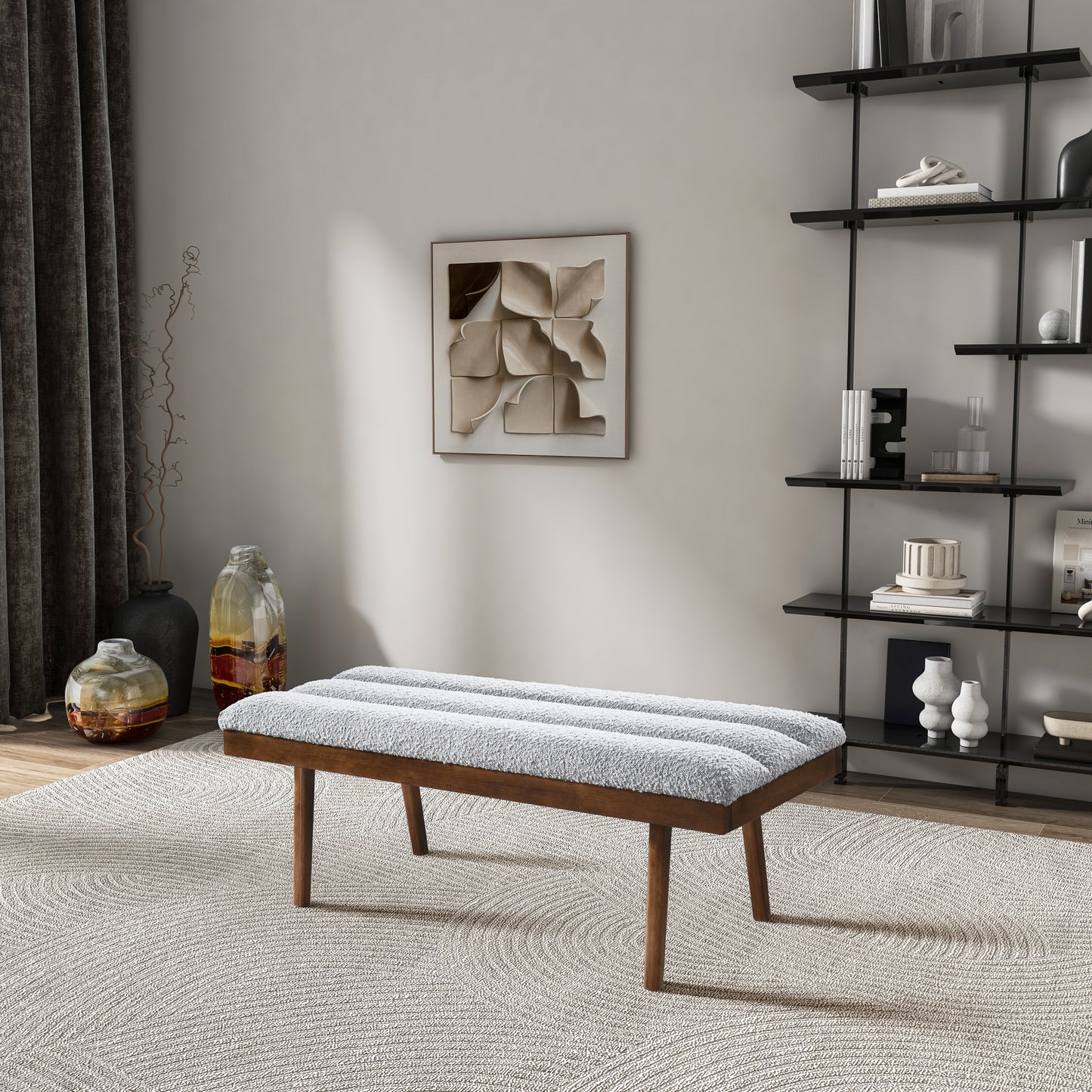 Midcentury modern upholstered bench with plush grey fabric and wooden legs