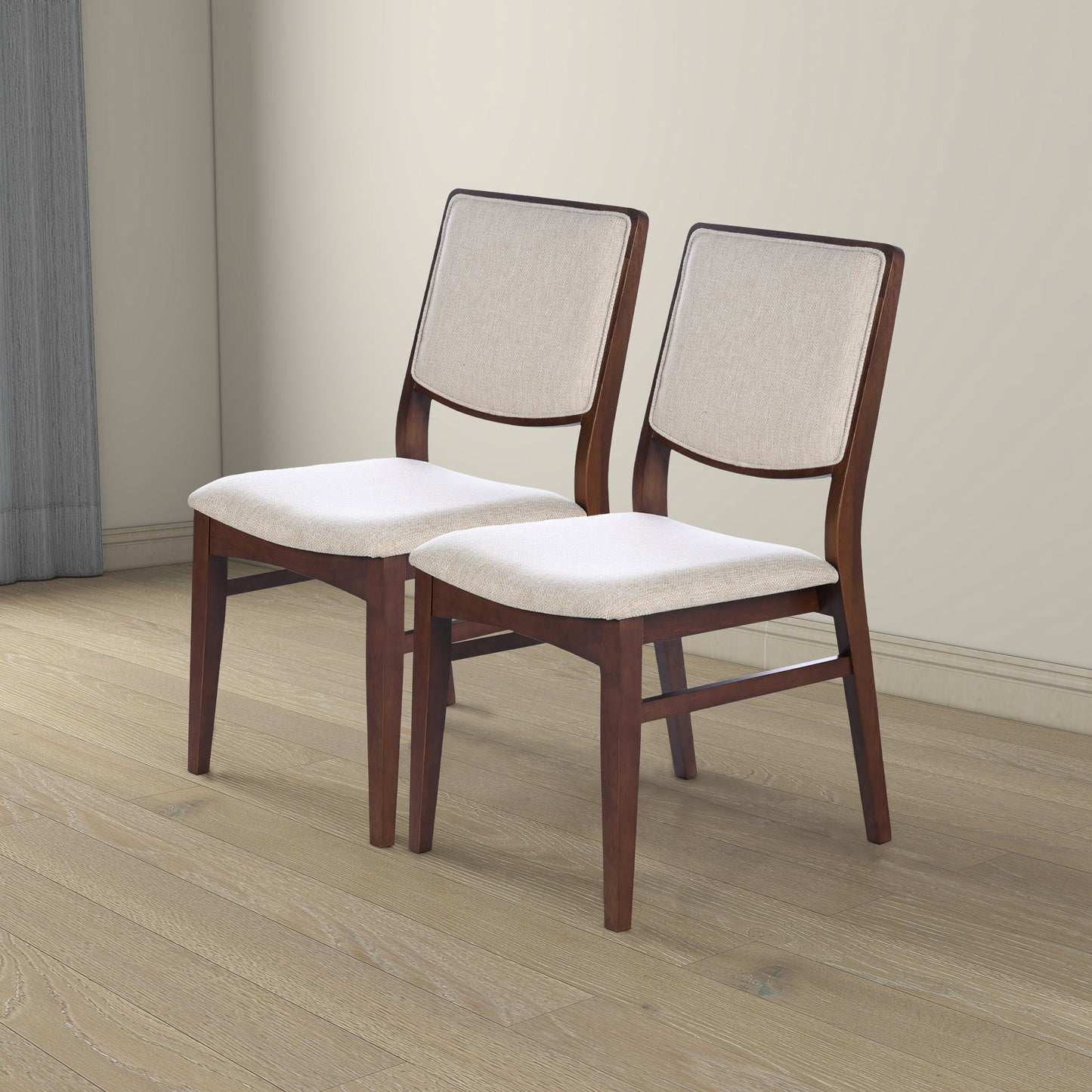 Upholstered dining chairs with dark wood frame and neutral fabric seat