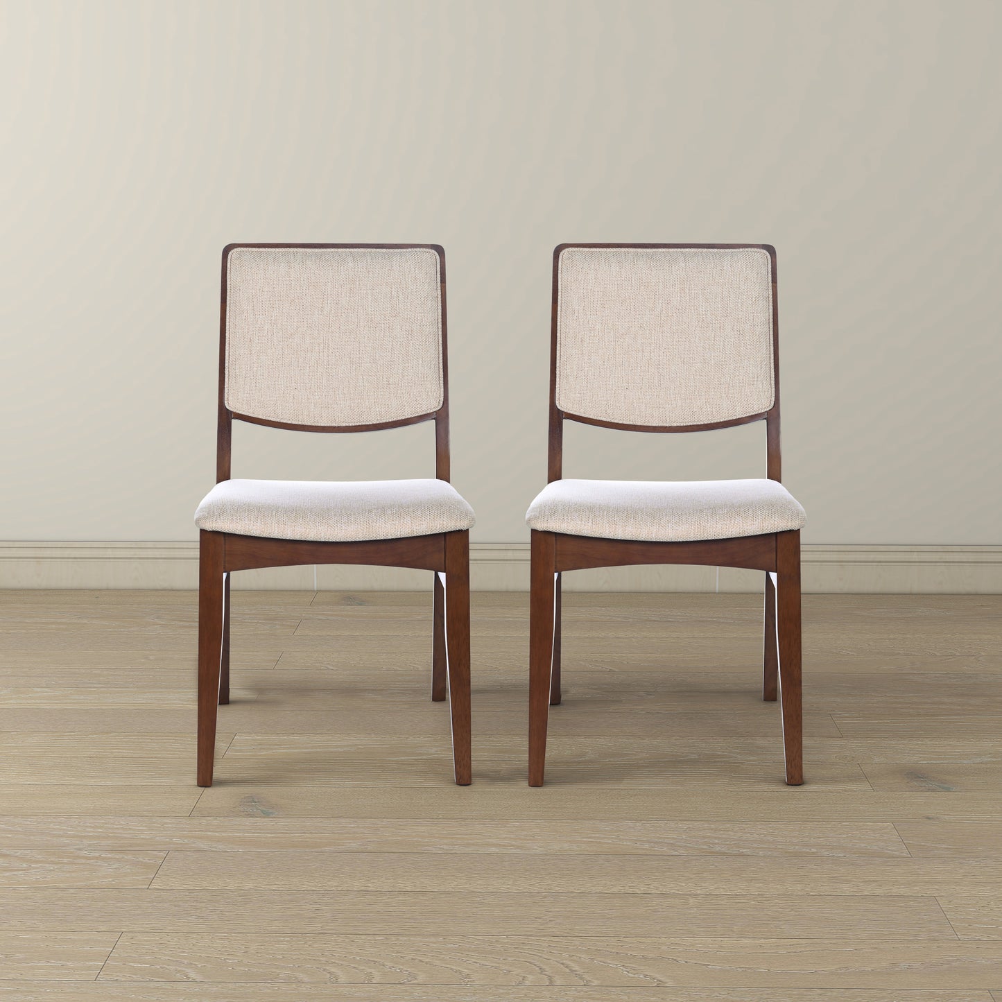 Two upholstered dining chairs with wooden frames
