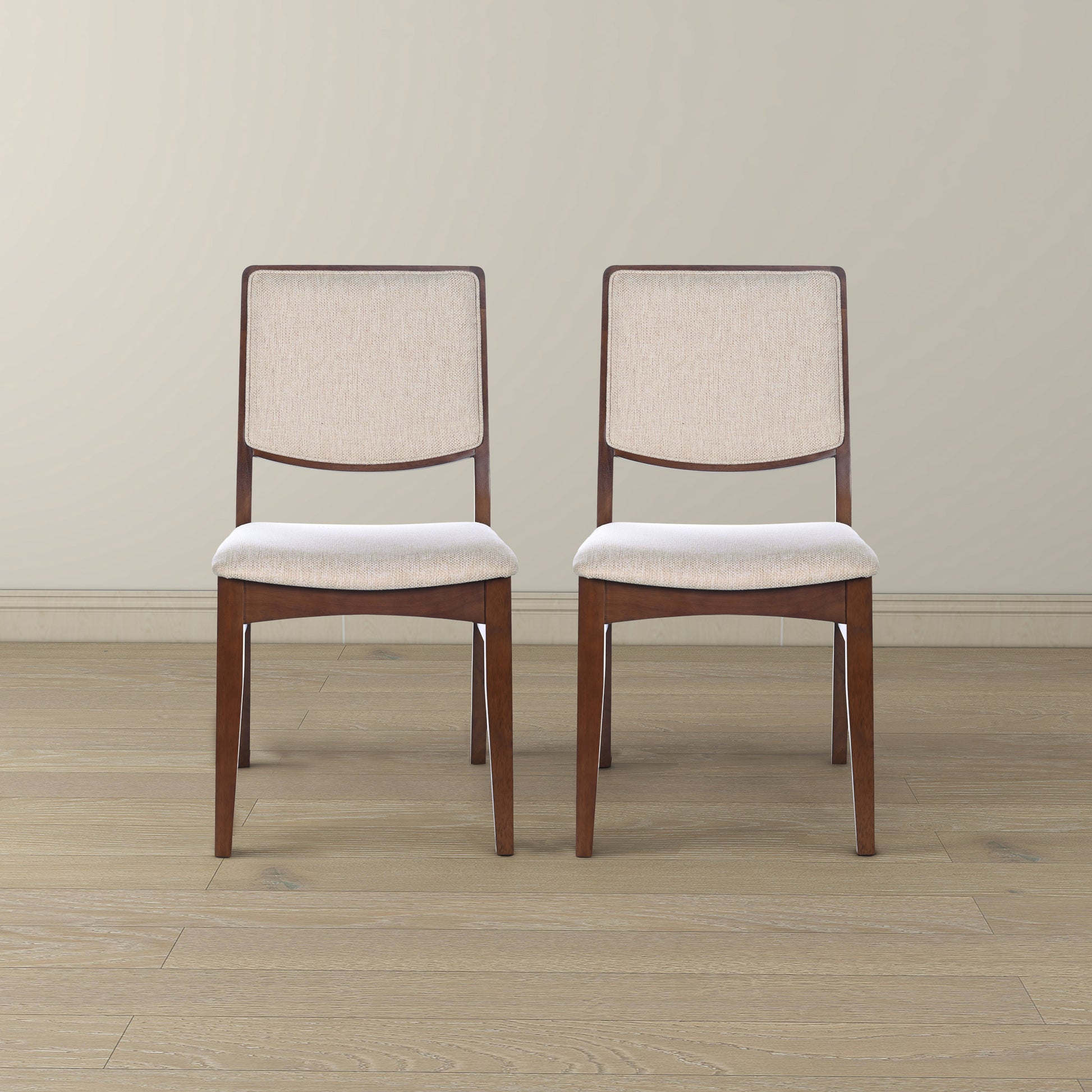 Two upholstered dining chairs with wooden frames