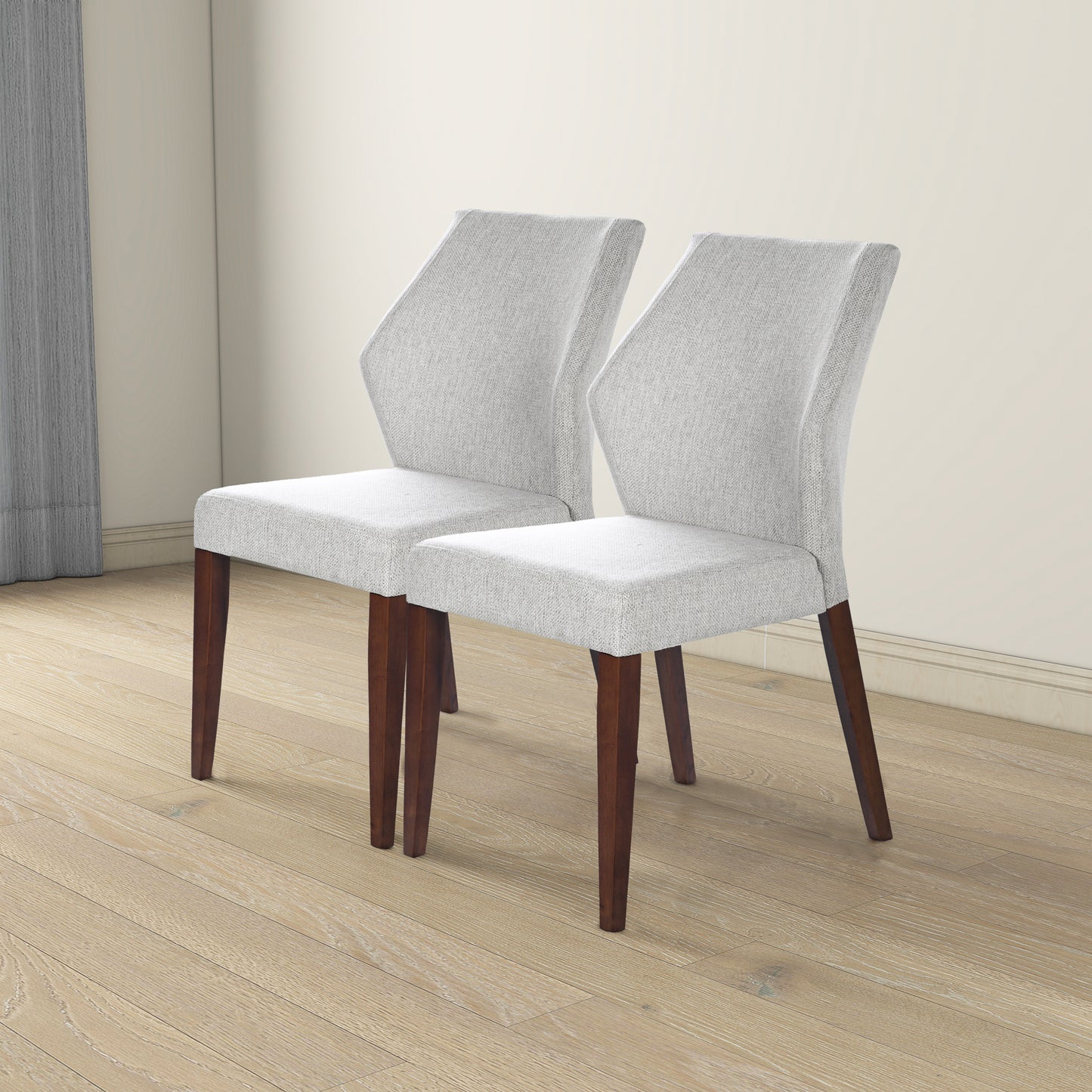 Modern grey upholstered dining chairs with dark wood legs