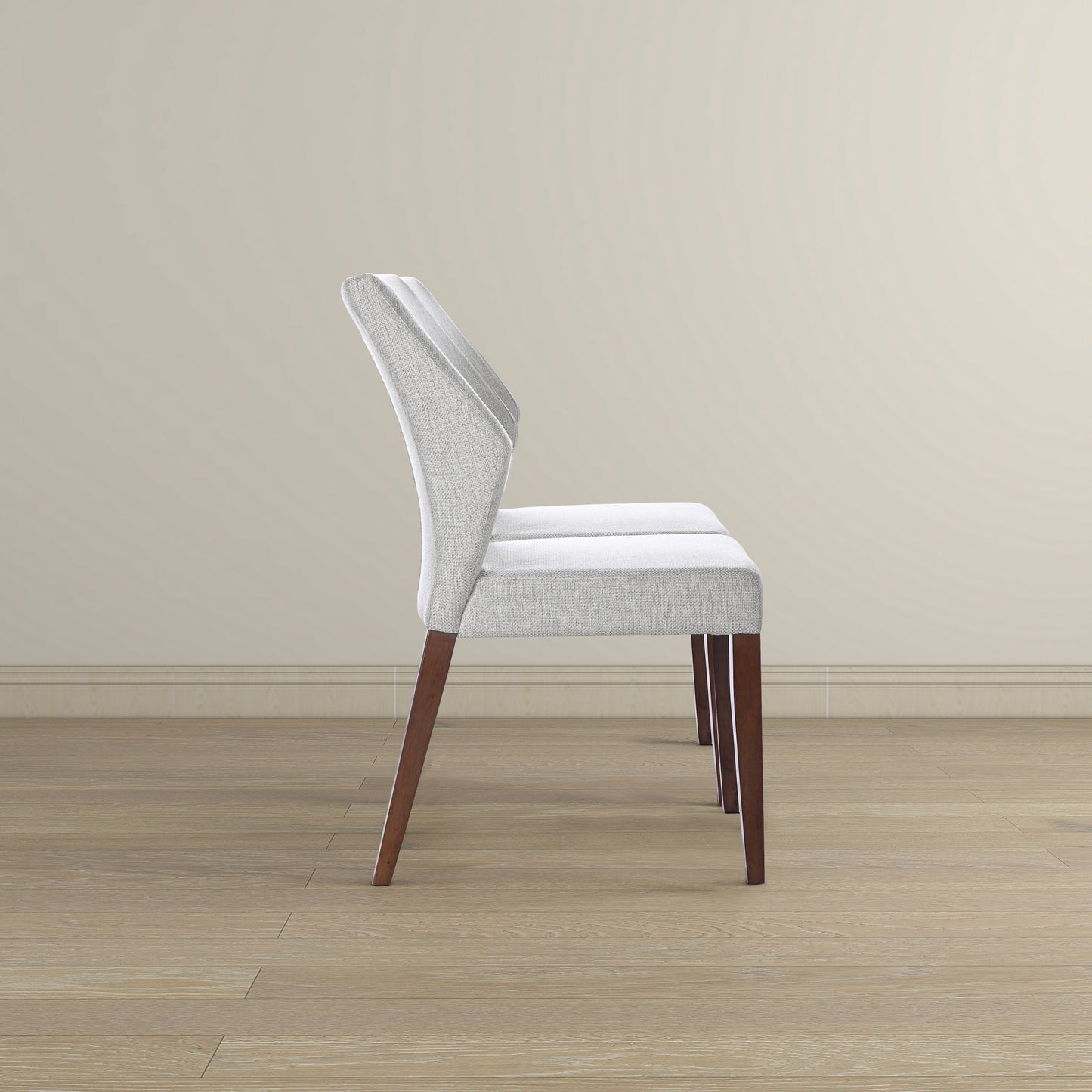 Light grey upholstered dining chair with angled wooden legs
